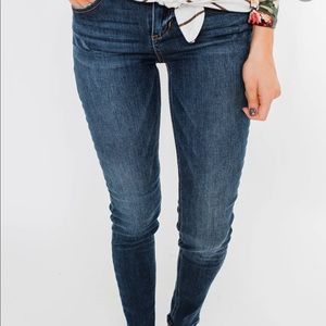 Sneak peek dark wash ankle zip jeans